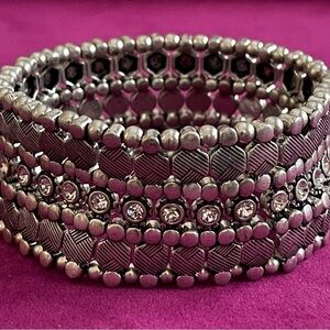 ALL SILVER AND CRYSTAL BAND STRETCH
BRACELET/7"WRIST/marked WITH CROWN INSIDE